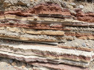 Cross-section of layered sedimentary rock strata, photo