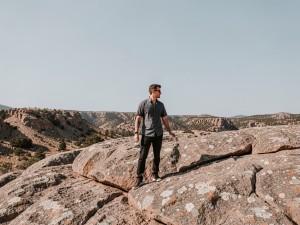 Person standing on rock, photo