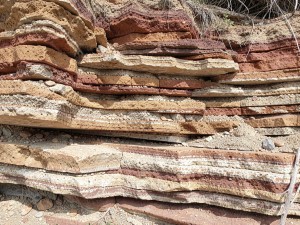 Stacked sedimentary rock layers cross-section, photo