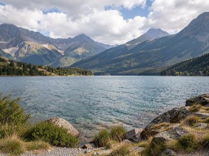 Landscape photography of body of water near mountain, photo