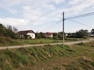 Landscape of house near electric post, photo